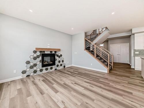 10214 92A Avenue, Morinville, AB - Indoor Photo Showing Living Room With Fireplace