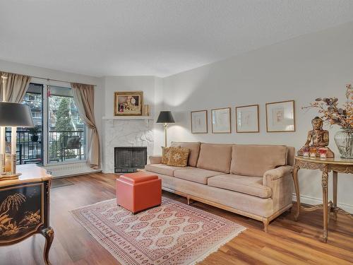 203 10421 93 Street, Edmonton, AB - Indoor Photo Showing Living Room With Fireplace