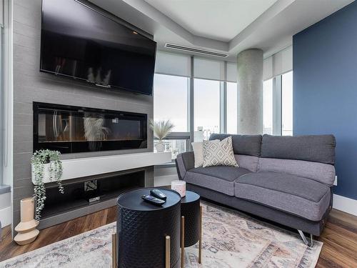 1701 11969 Jasper Avenue, Edmonton, AB - Indoor Photo Showing Living Room With Fireplace