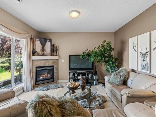 7 13808 155 Avenue, Edmonton, AB - Indoor Photo Showing Living Room With Fireplace