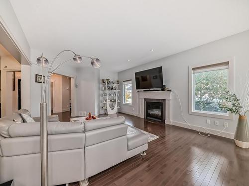 3503 Goodridge Bay Nw, Edmonton, AB - Indoor Photo Showing Living Room With Fireplace