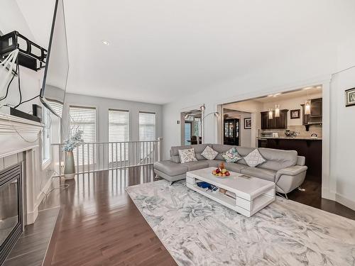 3503 Goodridge Bay Nw, Edmonton, AB - Indoor Photo Showing Living Room With Fireplace