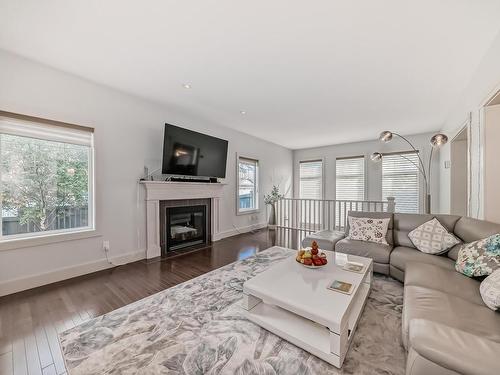 3503 Goodridge Bay Nw, Edmonton, AB - Indoor Photo Showing Living Room With Fireplace