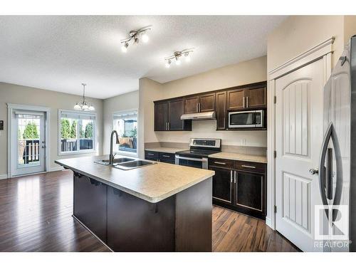 11620 17 Avenue, Edmonton, AB - Indoor Photo Showing Kitchen With Double Sink