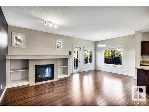 11620 17 Avenue, Edmonton, AB - Indoor Photo Showing Living Room With Fireplace