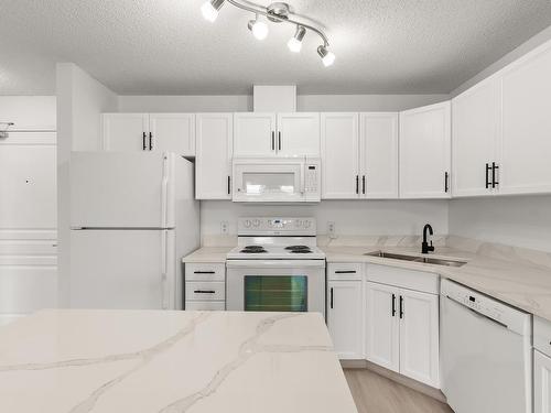 320 309 Clareview Station Drive, Edmonton, AB - Indoor Photo Showing Kitchen With Double Sink