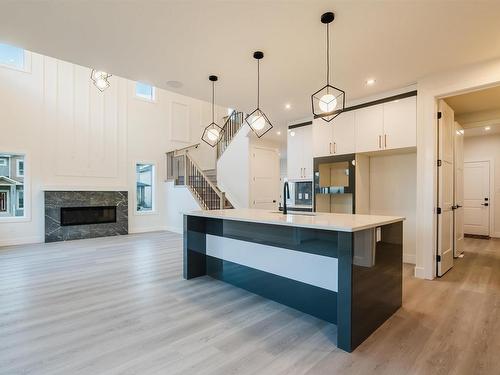 54 Prescott Boulevard, Spruce Grove, AB - Indoor Photo Showing Kitchen With Fireplace With Upgraded Kitchen