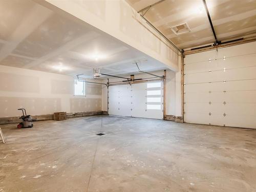 54 Prescott Boulevard, Spruce Grove, AB - Indoor Photo Showing Garage