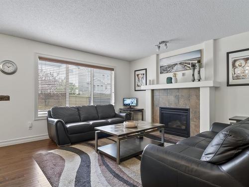 6111 10 Avenue, Edmonton, AB - Indoor Photo Showing Living Room With Fireplace