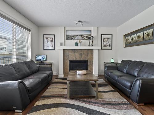 6111 10 Avenue, Edmonton, AB - Indoor Photo Showing Living Room With Fireplace