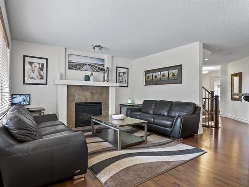 6111 10 Avenue, Edmonton, AB - Indoor Photo Showing Living Room With Fireplace