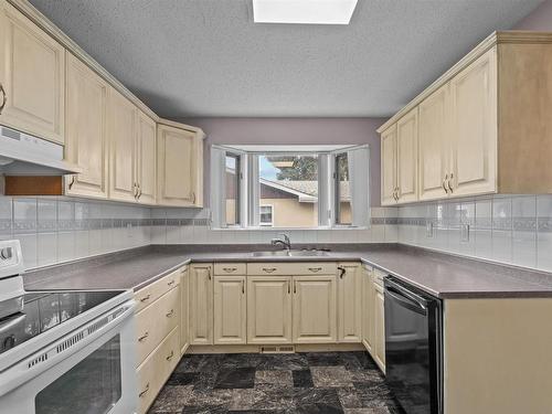 7821 154 Street, Edmonton, AB - Indoor Photo Showing Kitchen With Double Sink