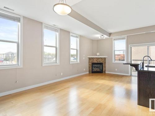 204 8223 99 Street, Edmonton, AB - Indoor Photo Showing Living Room With Fireplace