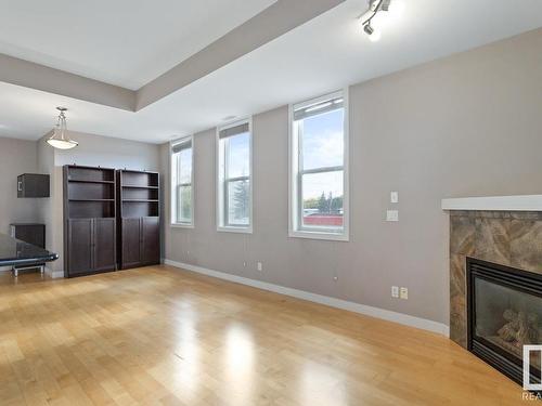 204 8223 99 Street, Edmonton, AB - Indoor Photo Showing Living Room With Fireplace