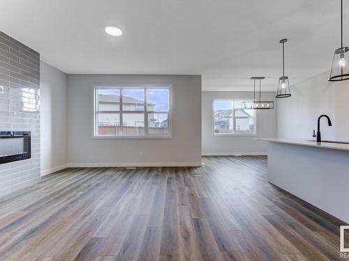 1835 Westerra Loop, Stony Plain, AB - Indoor Photo Showing Other Room With Fireplace