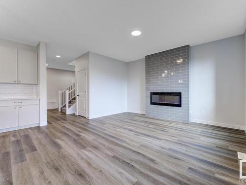 1835 Westerra Loop, Stony Plain, AB - Indoor Photo Showing Living Room With Fireplace