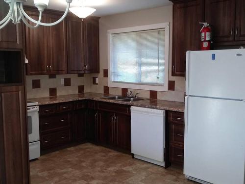 3409 Erickson Drive, Camrose, AB - Indoor Photo Showing Kitchen With Double Sink