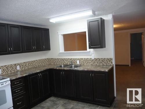 3409 Erickson Drive, Camrose, AB - Indoor Photo Showing Kitchen With Double Sink