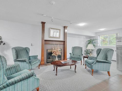 403 9760 176 Street, Edmonton, AB - Indoor Photo Showing Other Room With Fireplace