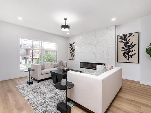 6923 Johnnie Caine Way, Edmonton, AB - Indoor Photo Showing Living Room With Fireplace