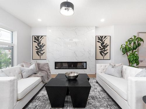 6923 Johnnie Caine Way, Edmonton, AB - Indoor Photo Showing Living Room With Fireplace