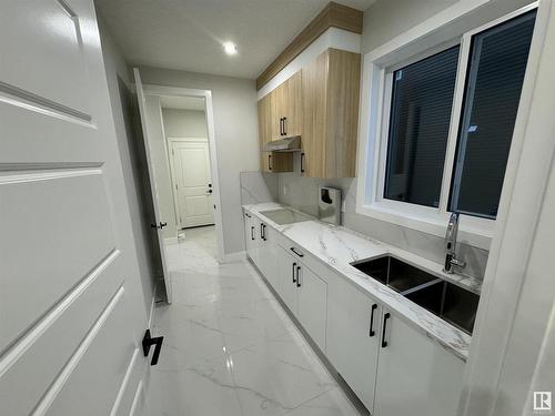 17039 45 Street, Edmonton, AB - Indoor Photo Showing Kitchen With Double Sink