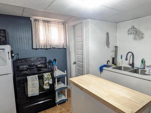 6002 50 Street, Vegreville, AB - Indoor Photo Showing Kitchen With Double Sink