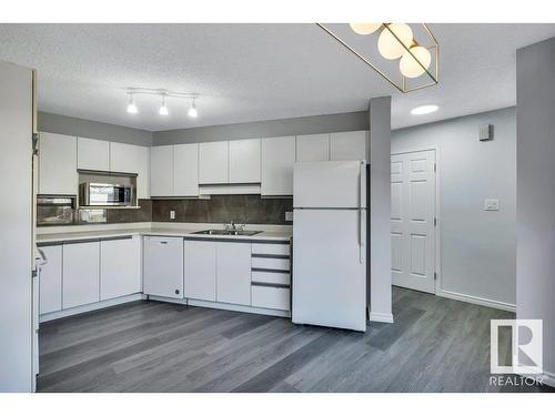 Edmonton, AB - Indoor Photo Showing Kitchen With Double Sink