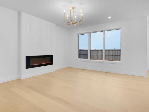 4687 Chegwin Wynd, Edmonton, AB - Indoor Photo Showing Living Room With Fireplace