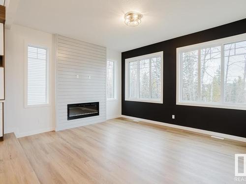 672 Astoria Way, Devon, AB - Indoor Photo Showing Living Room With Fireplace