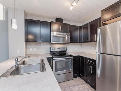 114 3670 139 Avenue, Edmonton, AB - Indoor Photo Showing Kitchen With Stainless Steel Kitchen With Double Sink