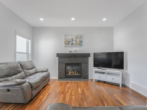 581 Mcdonough Way, Edmonton, AB - Indoor Photo Showing Living Room With Fireplace