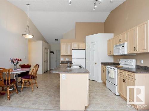 16 4527 55 Avenue, Tofield, AB - Indoor Photo Showing Kitchen With Double Sink