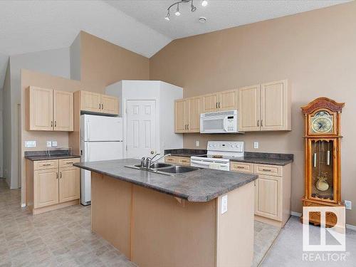 16 4527 55 Avenue, Tofield, AB - Indoor Photo Showing Kitchen With Double Sink