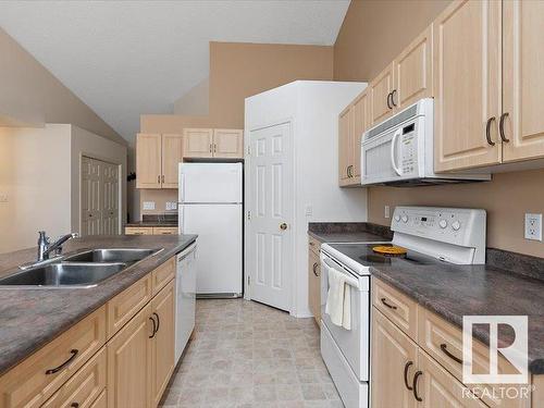 16 4527 55 Avenue, Tofield, AB - Indoor Photo Showing Kitchen With Double Sink