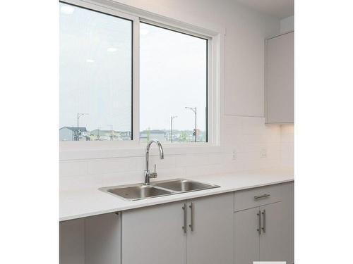 3987 Wren Loop, Edmonton, AB - Indoor Photo Showing Kitchen With Double Sink