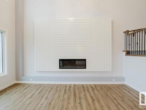 696 Astoria Way, Devon, AB - Indoor Photo Showing Other Room With Fireplace