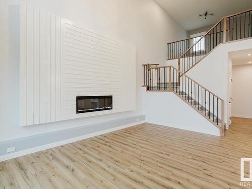 696 Astoria Way, Devon, AB - Indoor Photo Showing Other Room With Fireplace