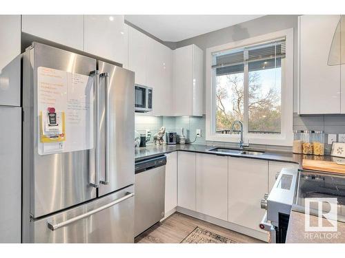 302 9907 91 Avenue, Edmonton, AB - Indoor Photo Showing Kitchen With Double Sink