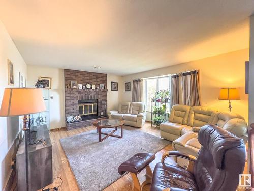 4302 41 Street, Bonnyville Town, AB - Indoor Photo Showing Living Room With Fireplace