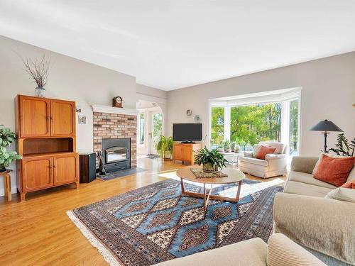 51213 Rr222, Rural Strathcona County, AB - Indoor Photo Showing Living Room With Fireplace