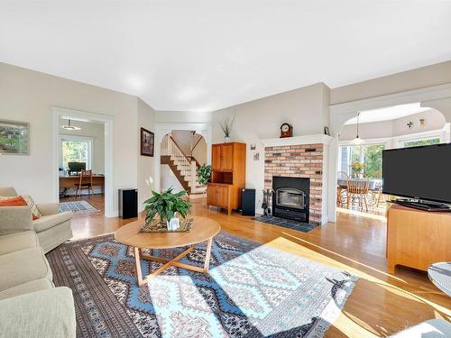 51213 Rr222, Rural Strathcona County, AB - Indoor Photo Showing Living Room With Fireplace