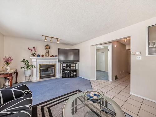 19032 56 Avenue Nw, Edmonton, AB - Indoor Photo Showing Living Room With Fireplace