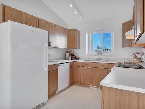 44 Campbell Road, Leduc, AB - Indoor Photo Showing Kitchen With Double Sink