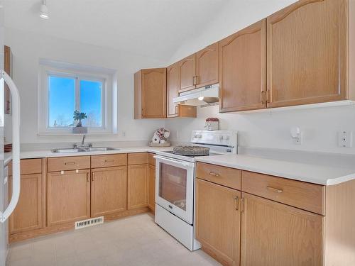 44 Campbell Road, Leduc, AB - Indoor Photo Showing Kitchen With Double Sink