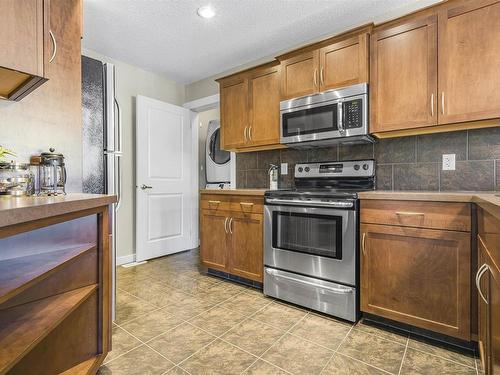 2216 Stan Waters Avenue, Edmonton, AB - Indoor Photo Showing Kitchen With Stainless Steel Kitchen