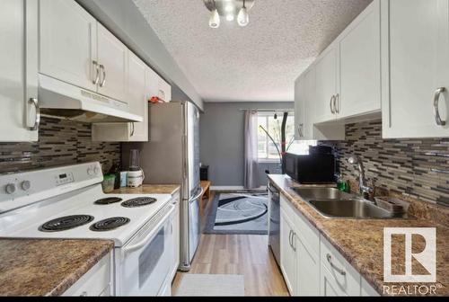 141 3308 113 Avenue, Edmonton, AB - Indoor Photo Showing Kitchen With Double Sink