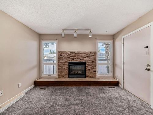 48 1904 48 Street, Edmonton, AB - Indoor Photo Showing Living Room With Fireplace