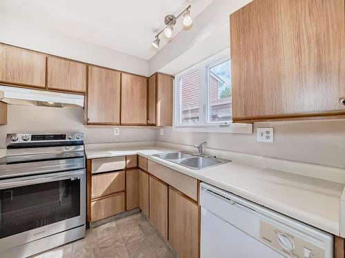 48 1904 48 Street, Edmonton, AB - Indoor Photo Showing Kitchen With Double Sink