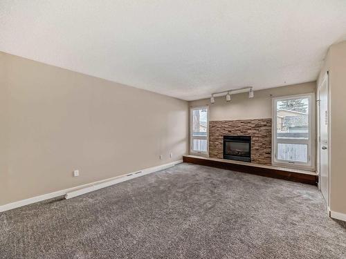 48 1904 48 Street, Edmonton, AB - Indoor Photo Showing Living Room With Fireplace